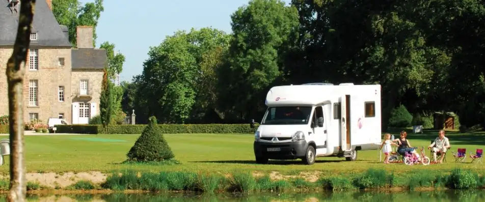 Campervan parked on the lawn of a Stately Home in the UK